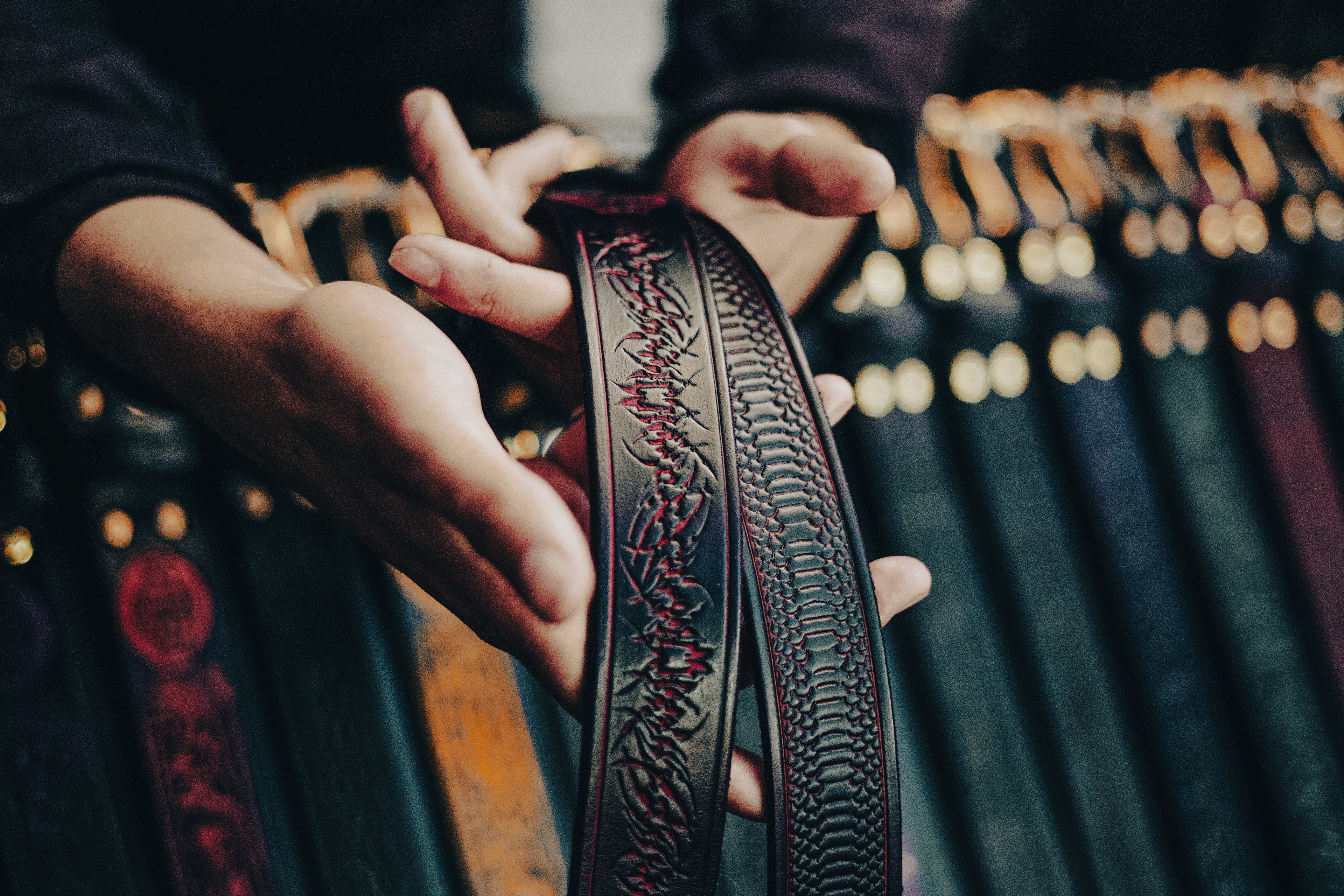 Handmade red leather y2k streetwear styled belts being displayed