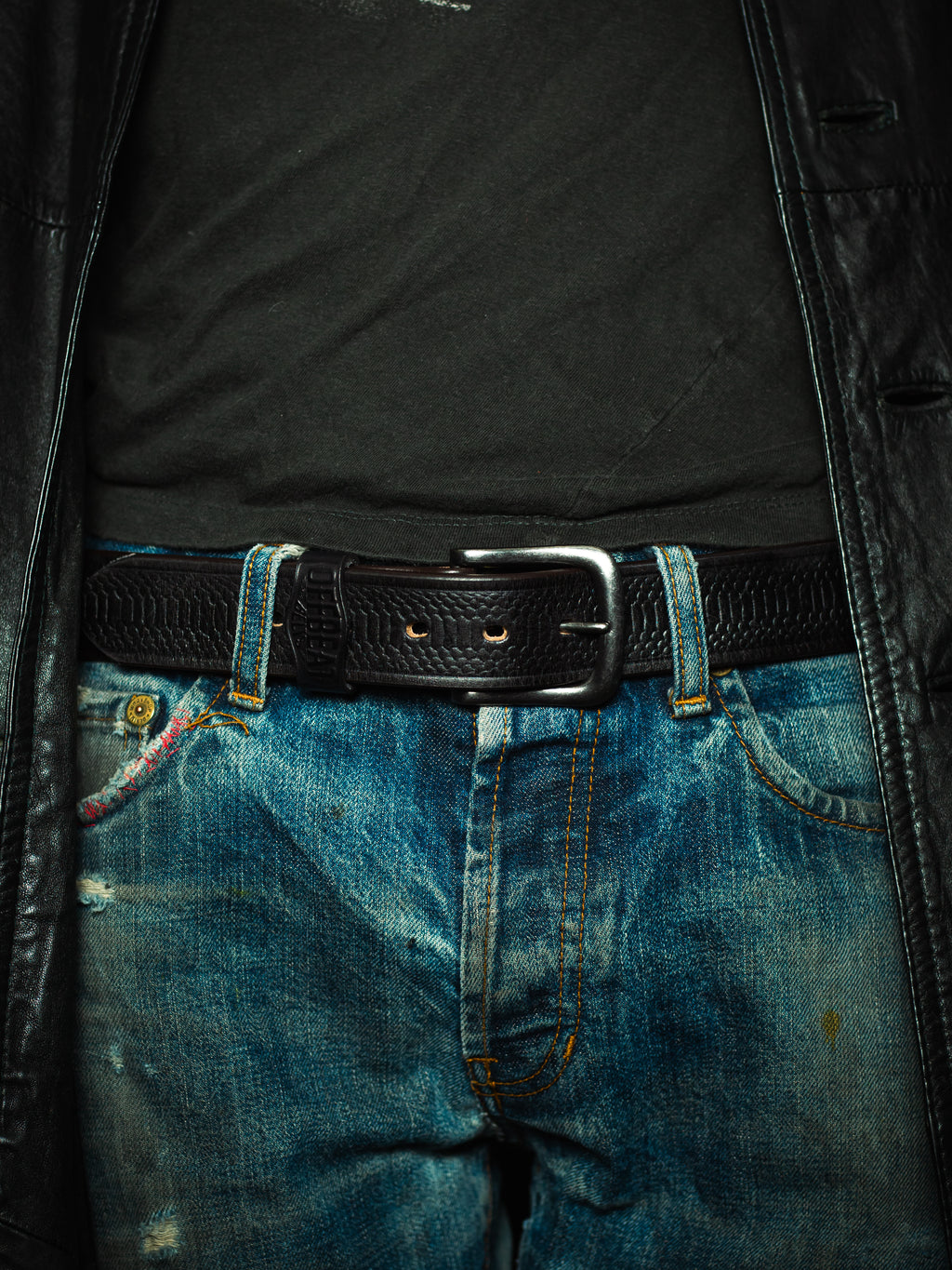Model wearing Y2k streetwear black leather belt with snake skin design
