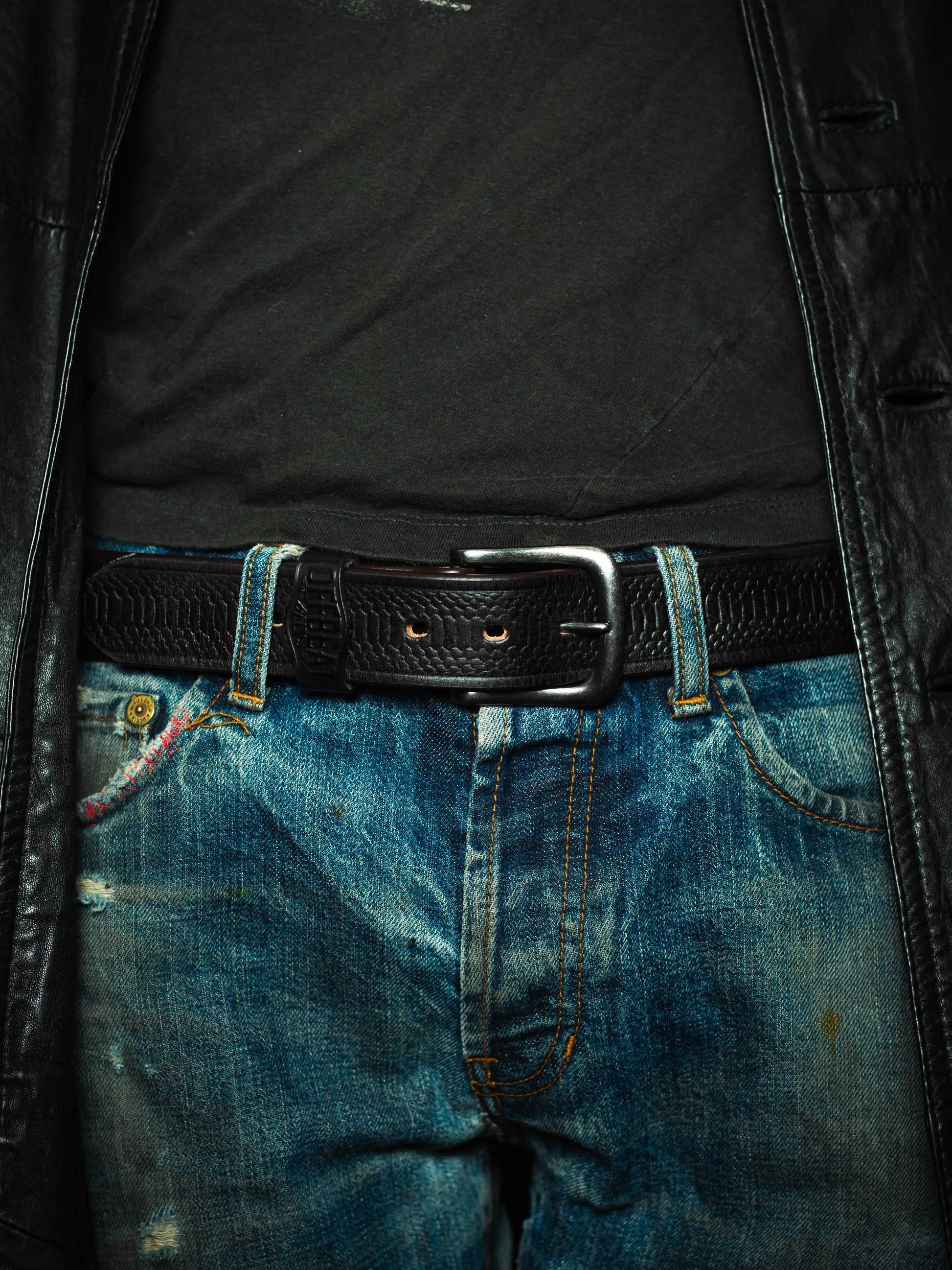 Model wearing Y2k streetwear black leather belt with snake skin design