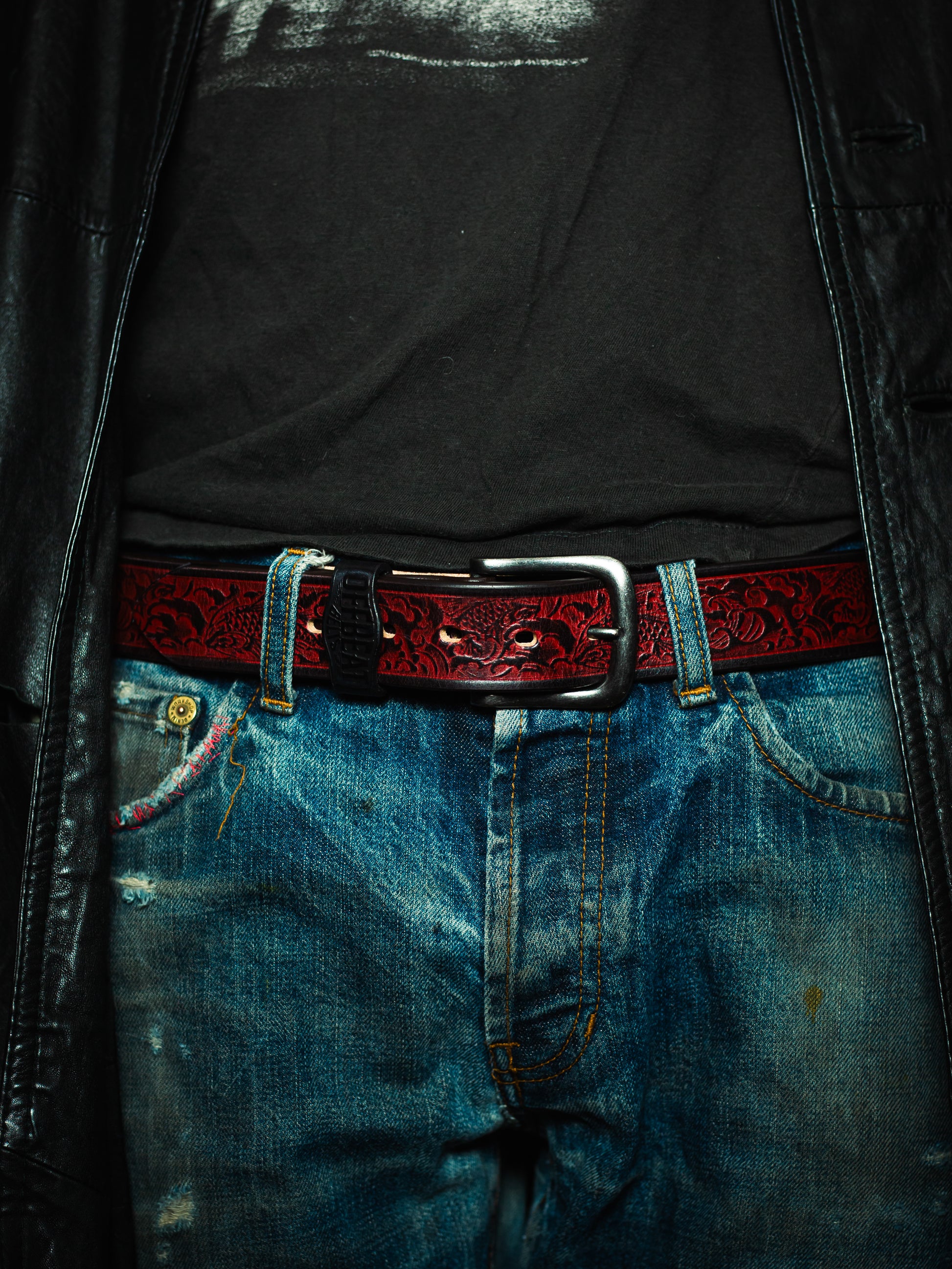 Model wearing Y2k streetwear red leather belt with Japanese fish design