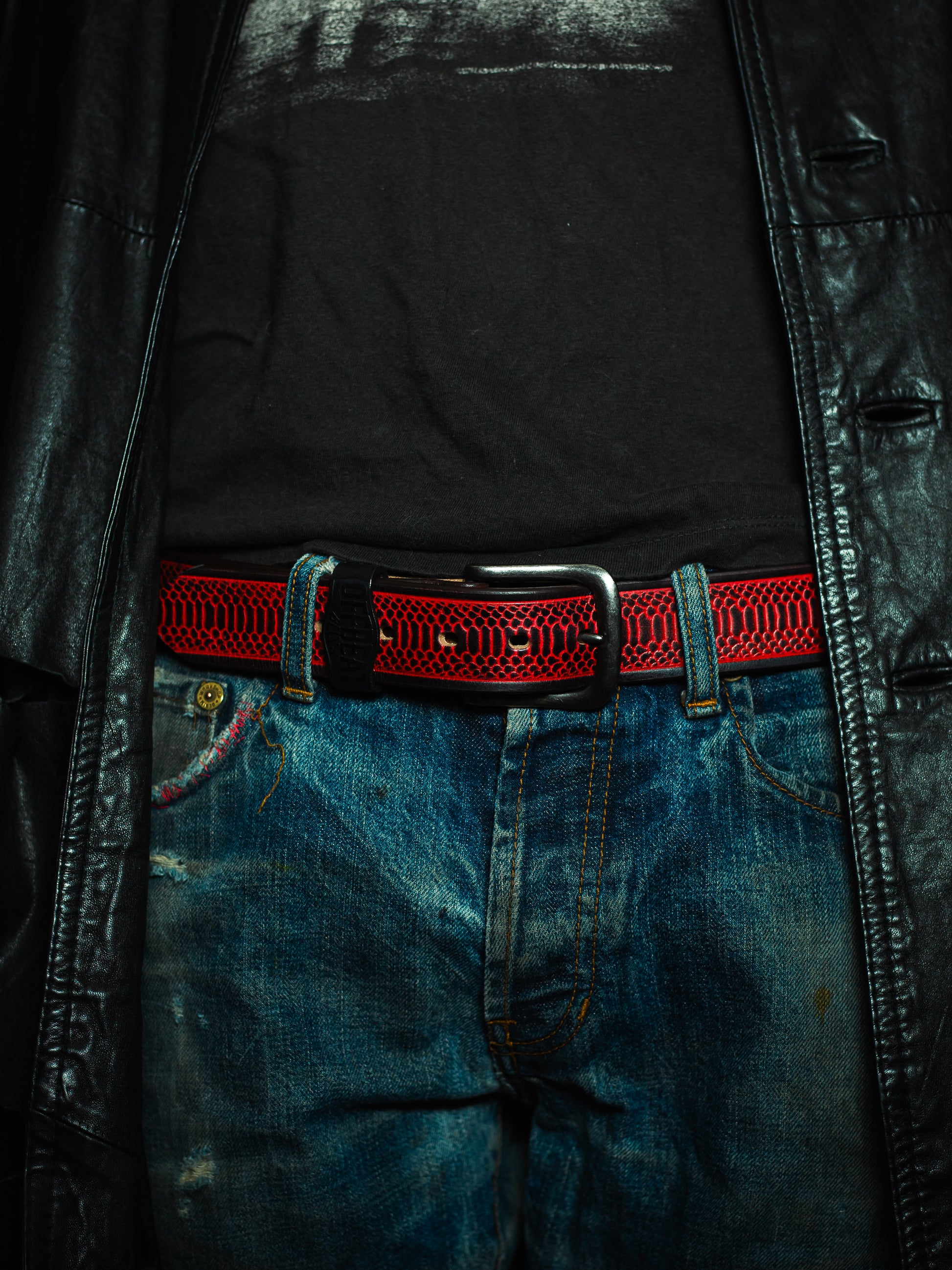 Model wearing Y2k streetwear red leather belt with snake skin design