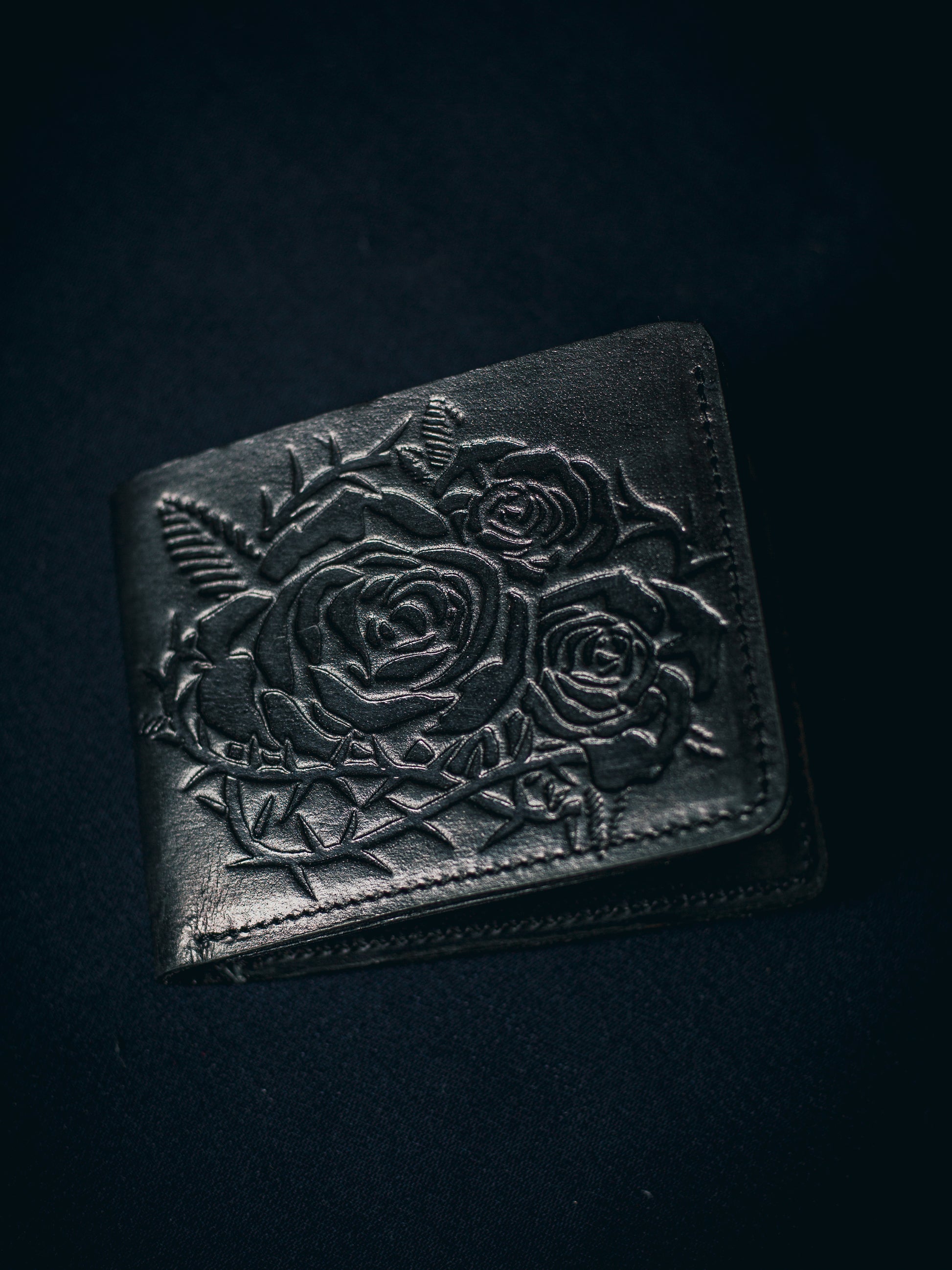 Handmade vintage black leather wallet with grunge-style floral embossing