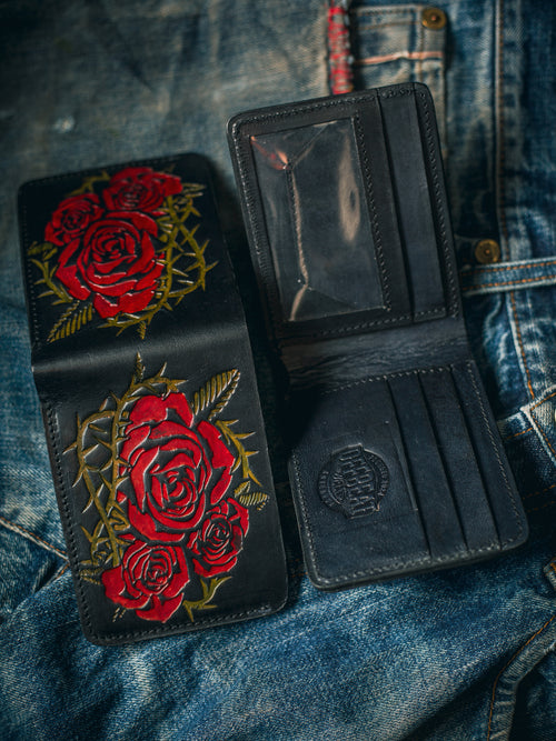 Front and back of handmade vintage red leather wallet with floral embossing